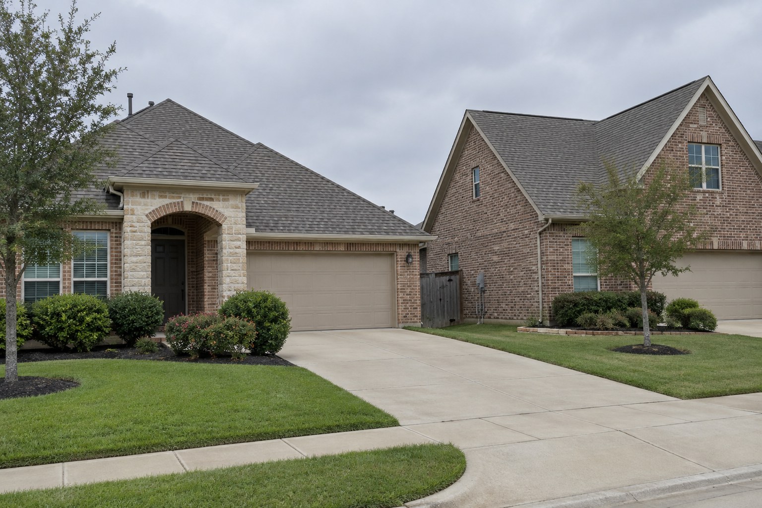 Two neighboring Allen TX brick homes showing a hip roof beside a gable roof