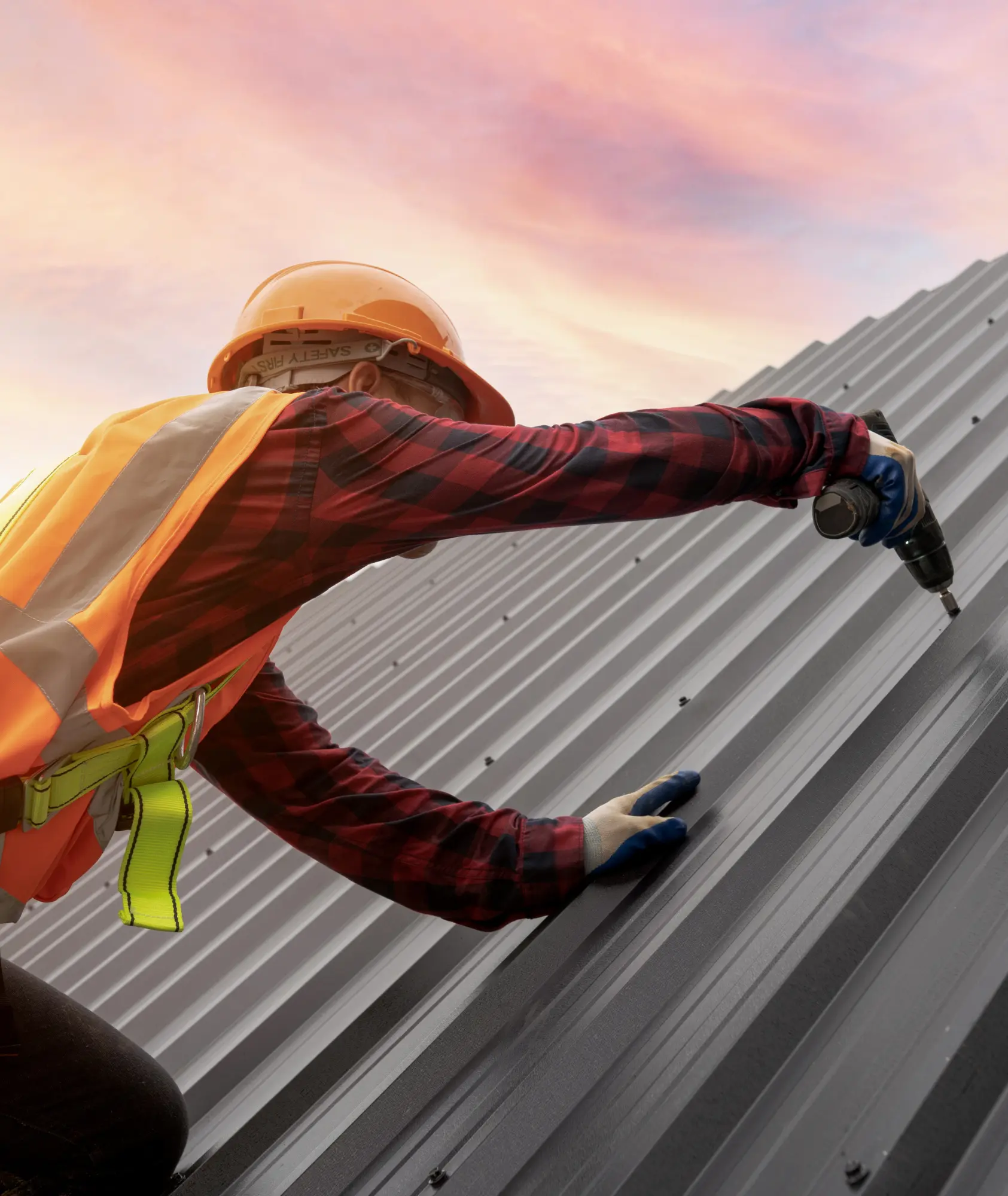 a man installing a metal roof different view